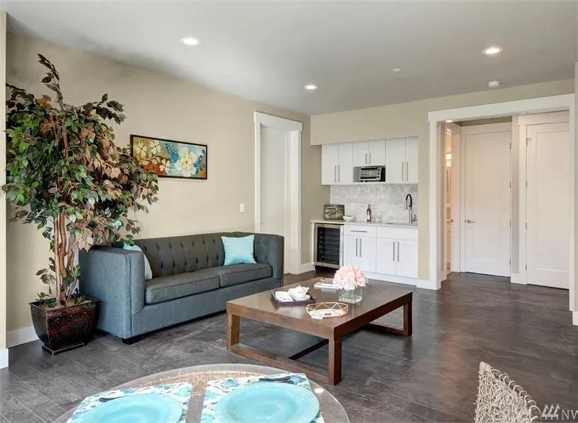 Compact Kitchenette, Wine Fridge, and a Sofa That Says "Stay a While"