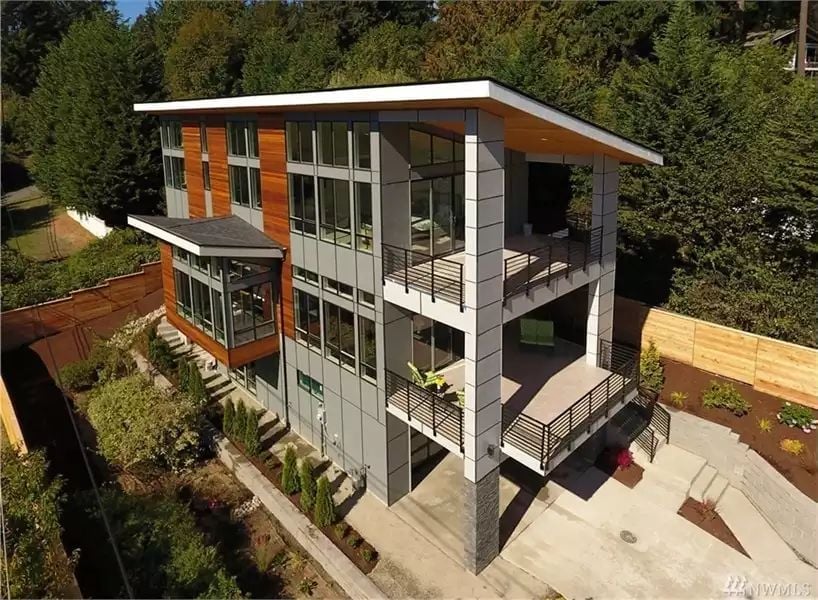 Three Stories of Glass, Cedar, and Balconies That Actually Earn Their Square Footage
