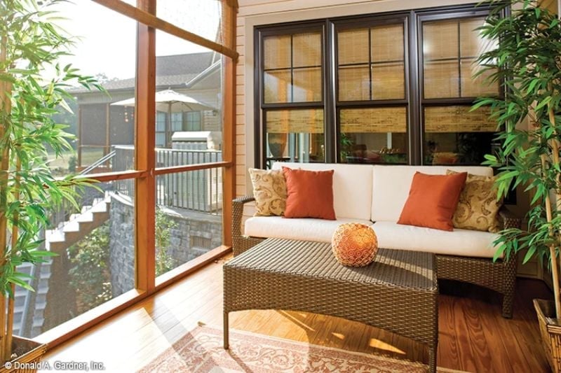 Wicker, Warm Wood, and a Screened Porch That Earns Its Square Footage