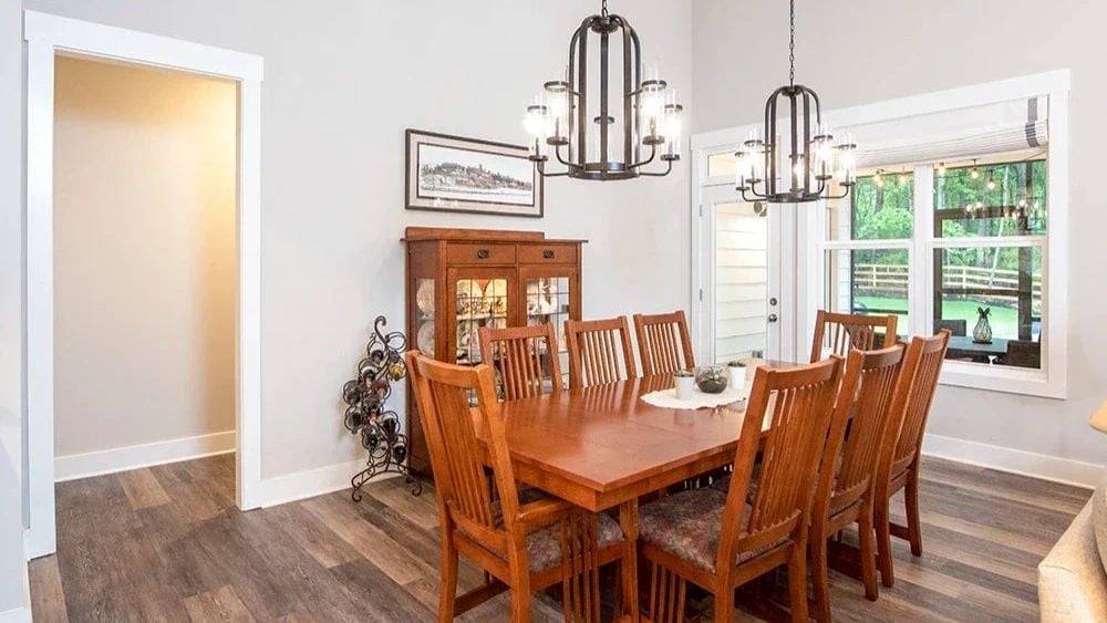 Craftsman Dining Set and Dual Chandeliers Pull the Room Together
