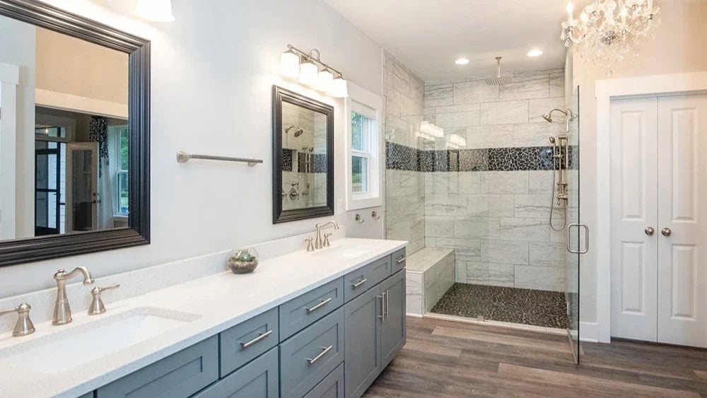 Pebble Floor and Marble Tile Make the Walk-In Shower Worth Lingering In