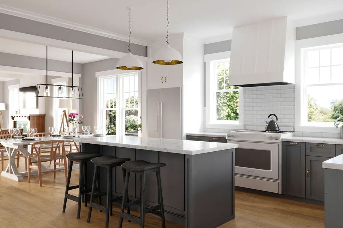 Dark Cabinetry and Marble Counters Make the Island the Obvious Anchor