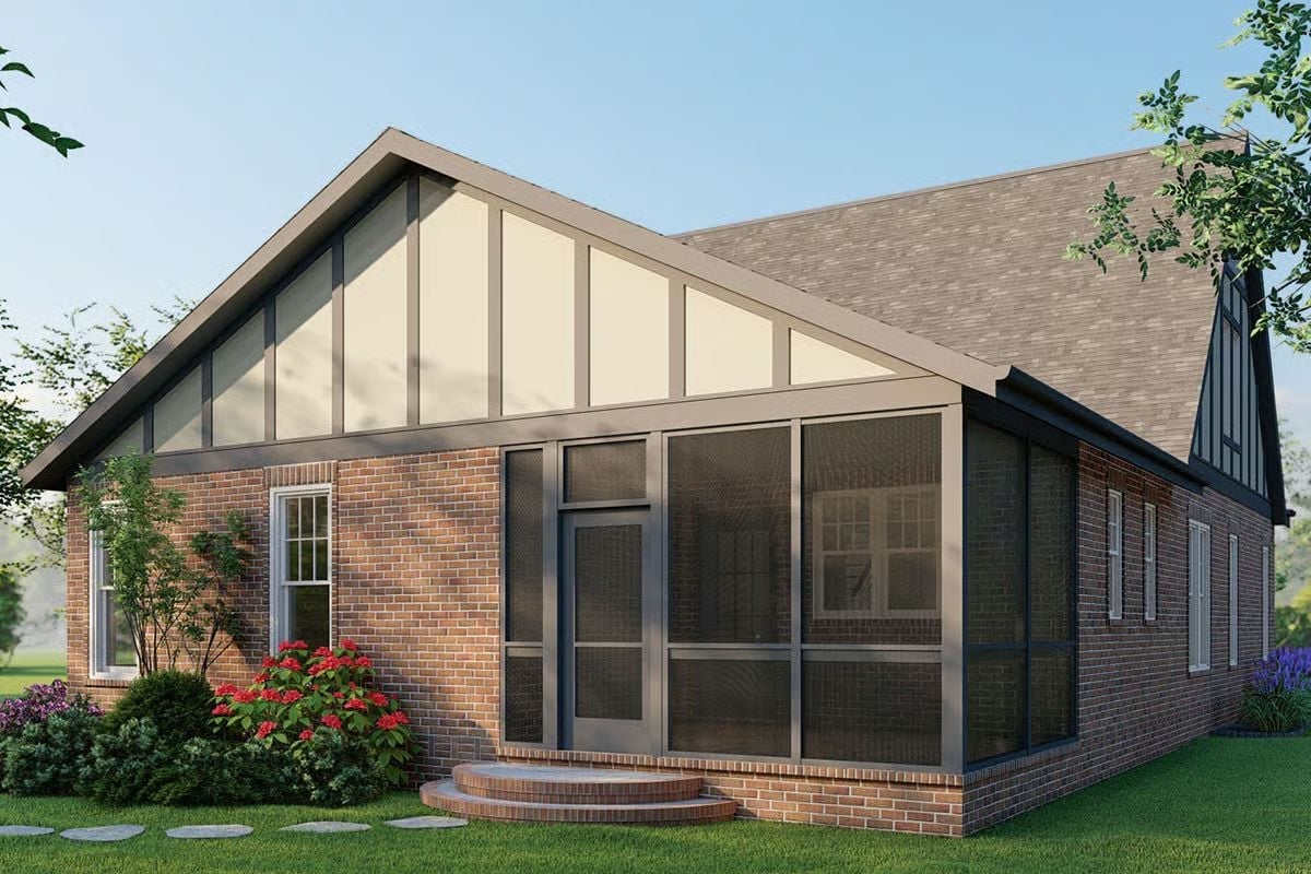 Screened Porch Addition Wraps the Brick Exterior in Full-Height Glass Panels
