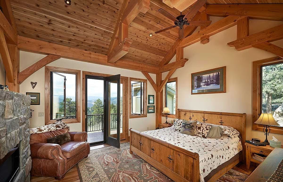 Timber Trusses and a Balcony View Turn This Master Bedroom Into the Best Seat in the House