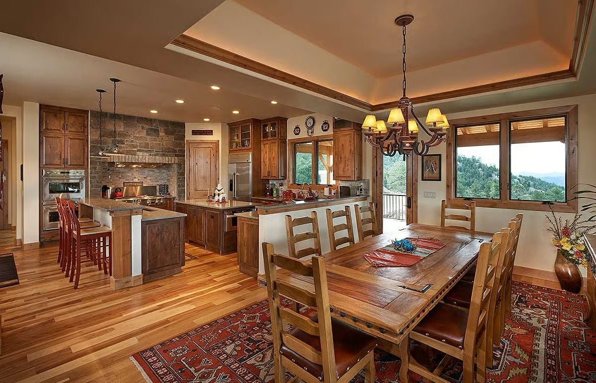 Warm Wood and Stone Pull the Kitchen and Dining Room Into One Cohesive Space