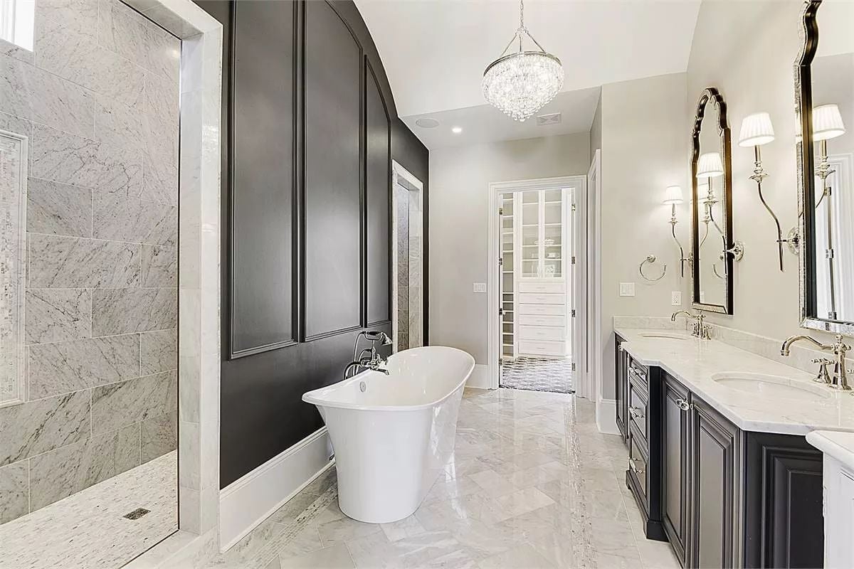 Crystal Chandelier Drops Into a Bathroom Where the Tub Gets Its Own Wall