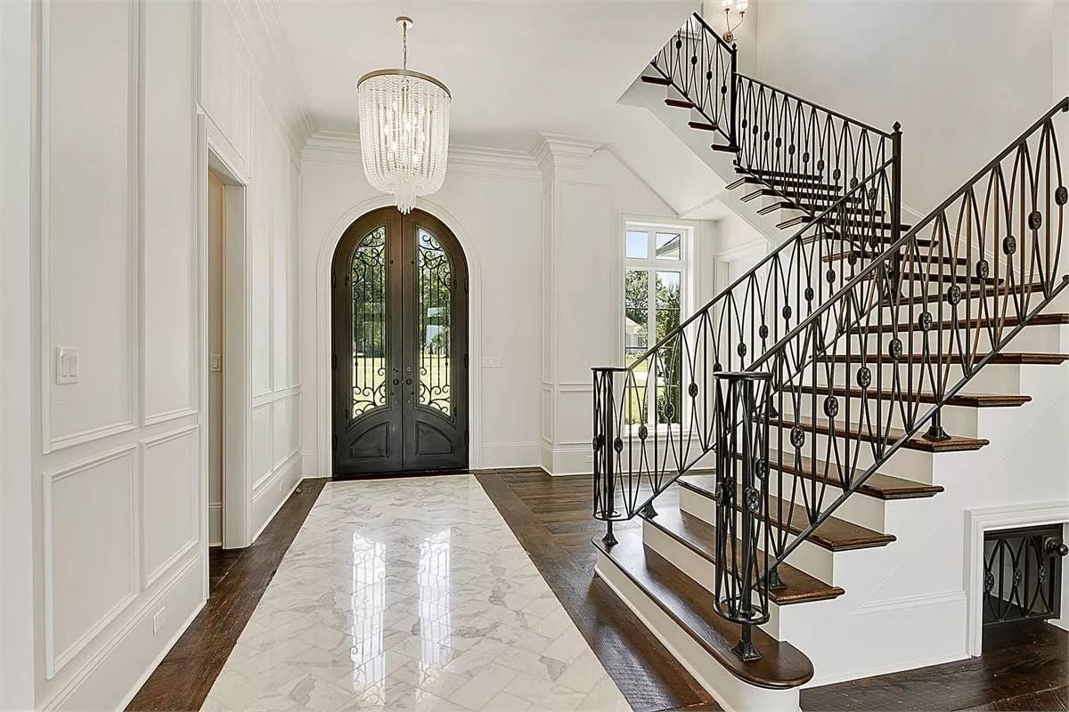 Marble Runner, Wrought Iron Rails, and a Front Door That Earns Its Keep