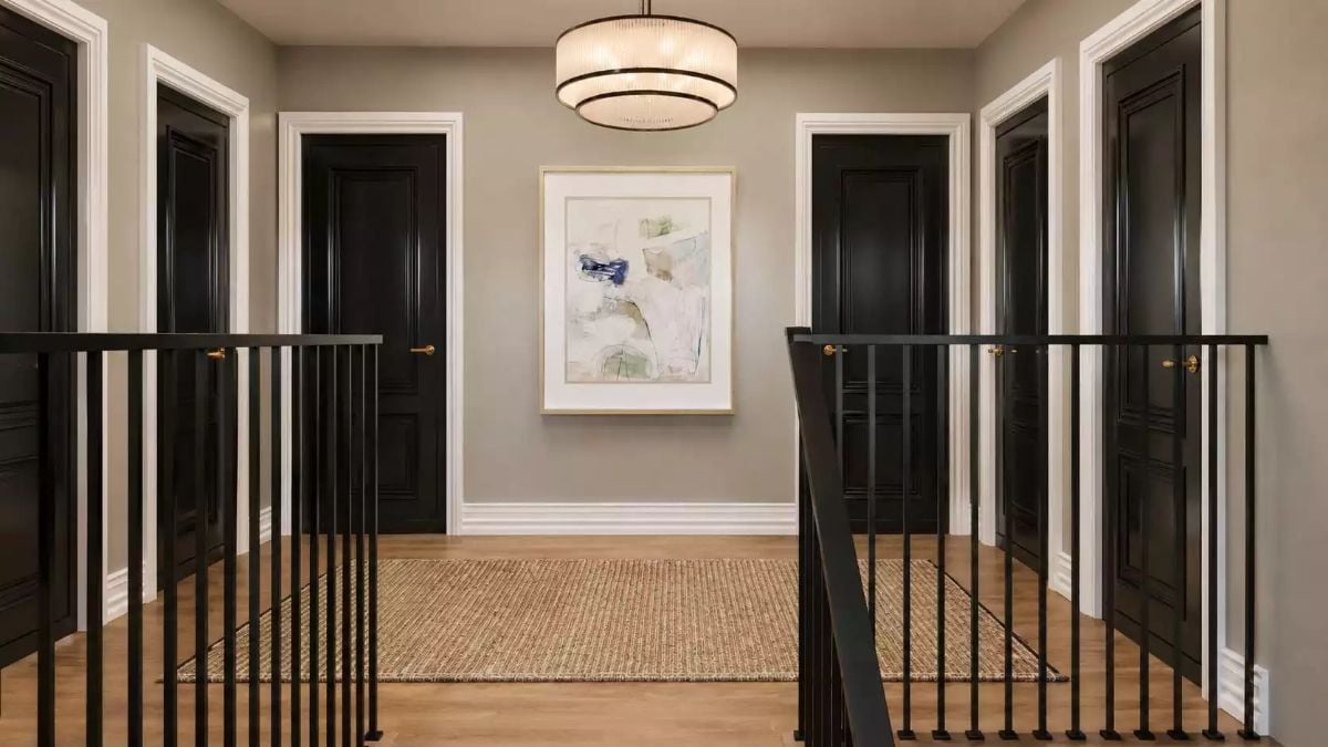 Black Doors, Iron Rails, and a Hallway Landing That Pulls Its Weight
