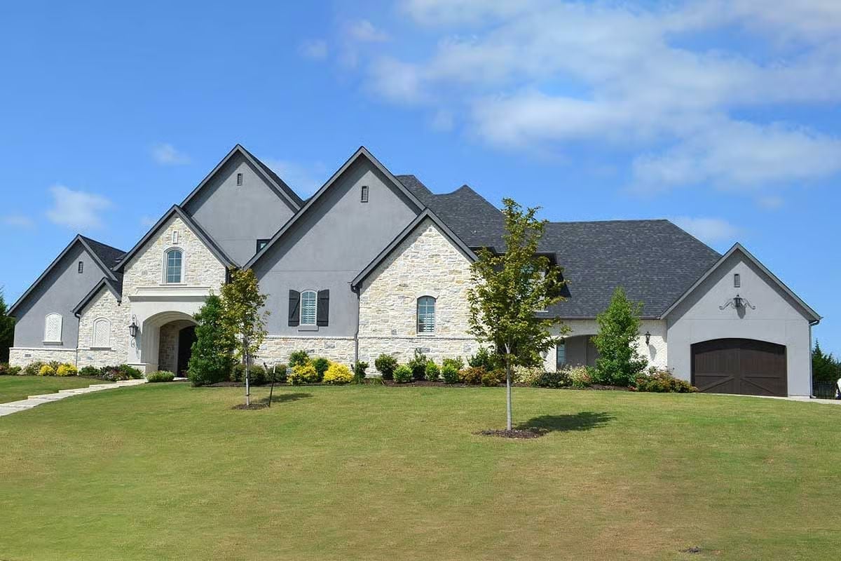 Stone, Stucco, and Sharp Gabled Peaks on a Lot That Earns Every Square Foot