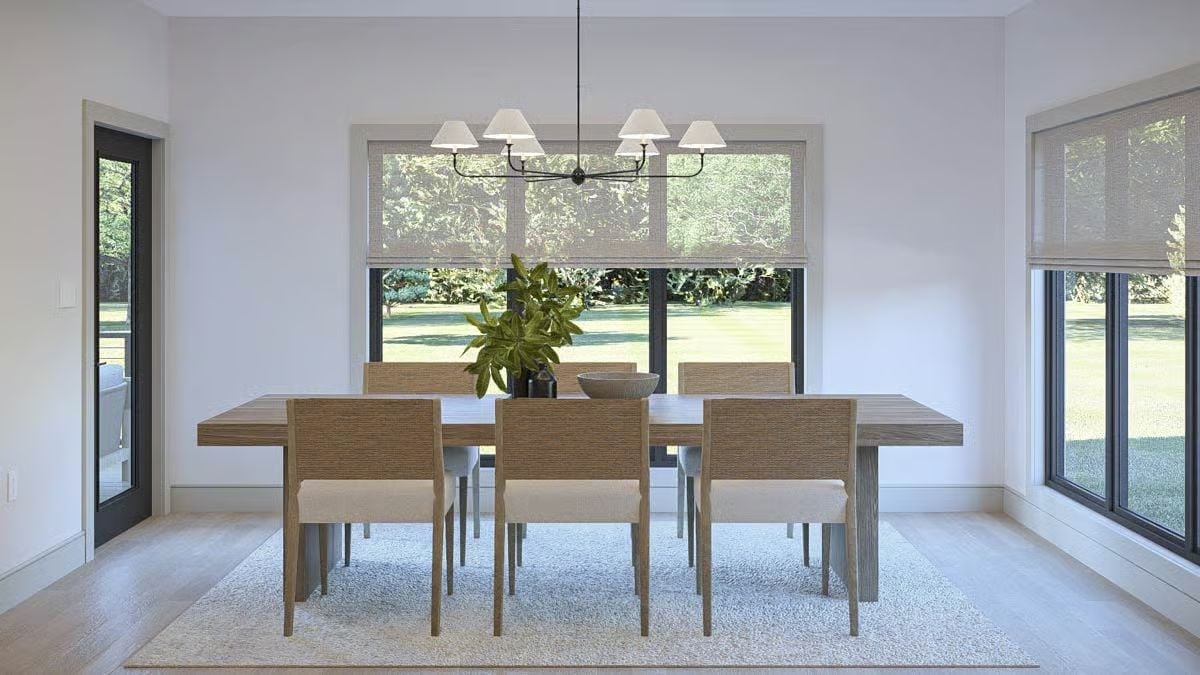 Sheer Roman Shades and a Six-Arm Chandelier Keep a Dining Room Grounded