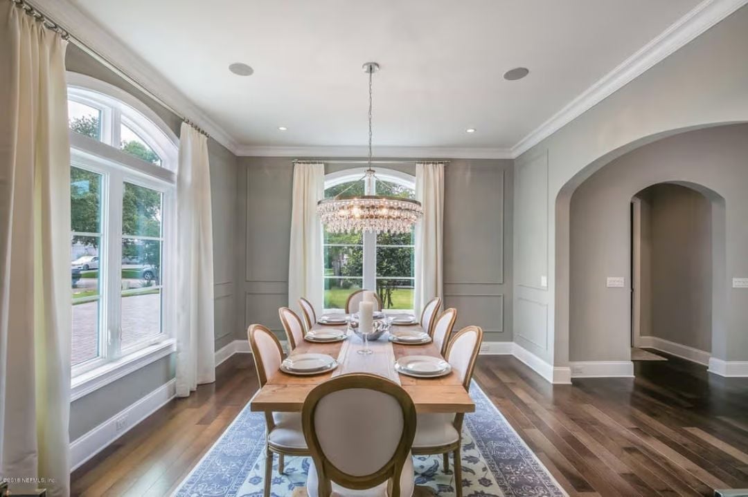 Crystal Chandelier and Panel Molding Make Formal Dining Feel Lived-In, Not Stiff