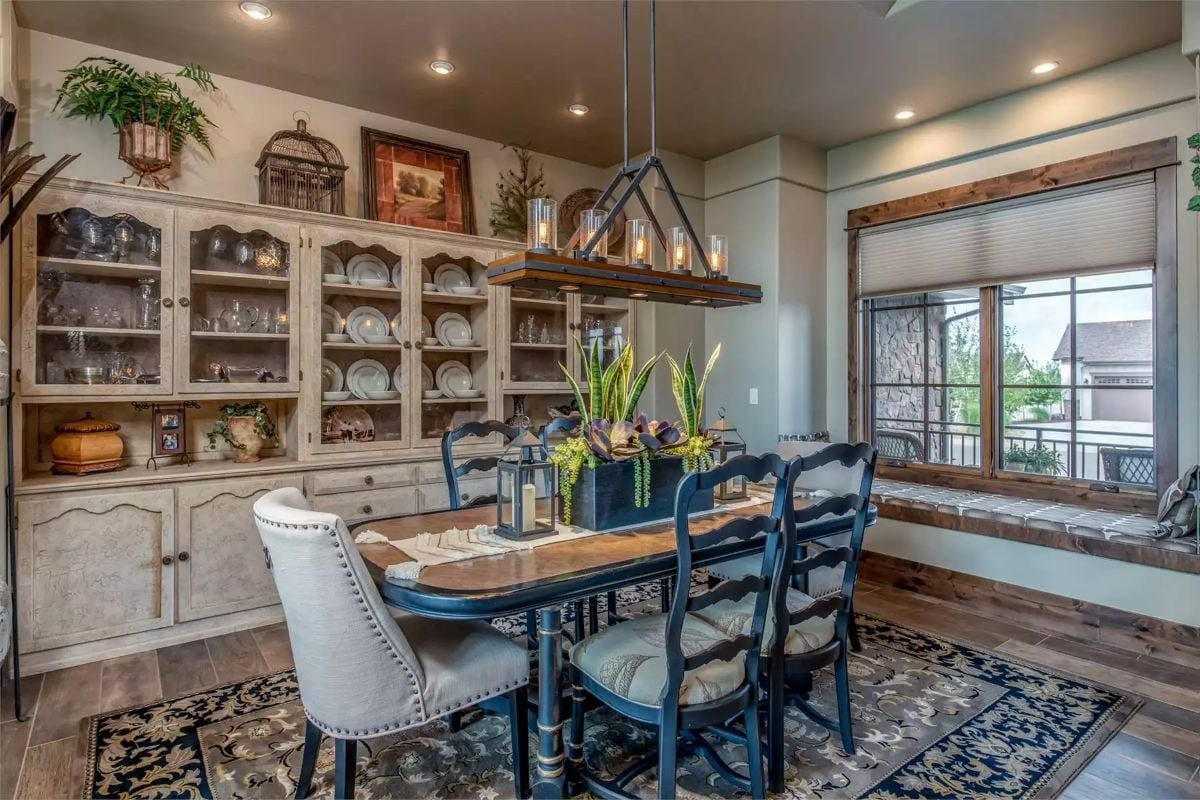Navy Ladder-Back Chairs and a Hutch Full of White Dishes Set a Quietly Confident Table