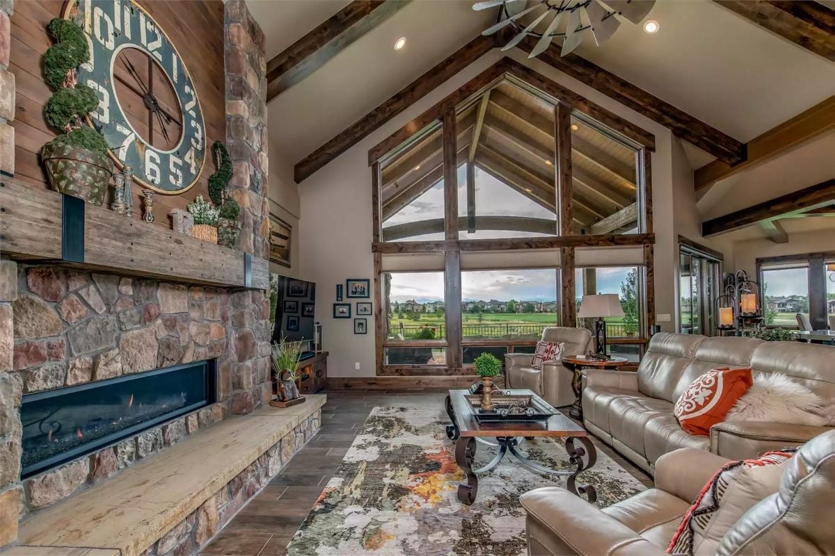 Stone Fireplace Wall and Vaulted Timber Ceiling Pull the Eye in Two Directions at Once