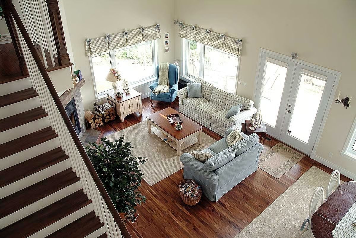 Plaid Sofas and Hardwood Floors Pull This Great Room Into Cottage Territory