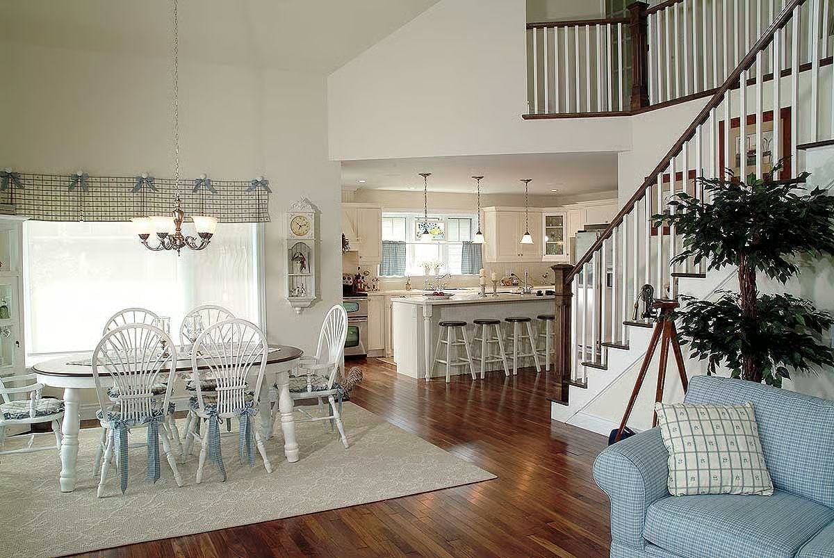 Wheatsheaf Chairs and Wainscoting Give This Dining Room Its Cottage Personality