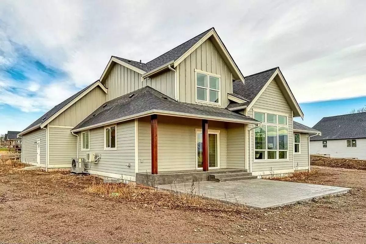 Board-and-Batten Siding and Dark Wood Columns Signal What's Inside Before You Open the Door