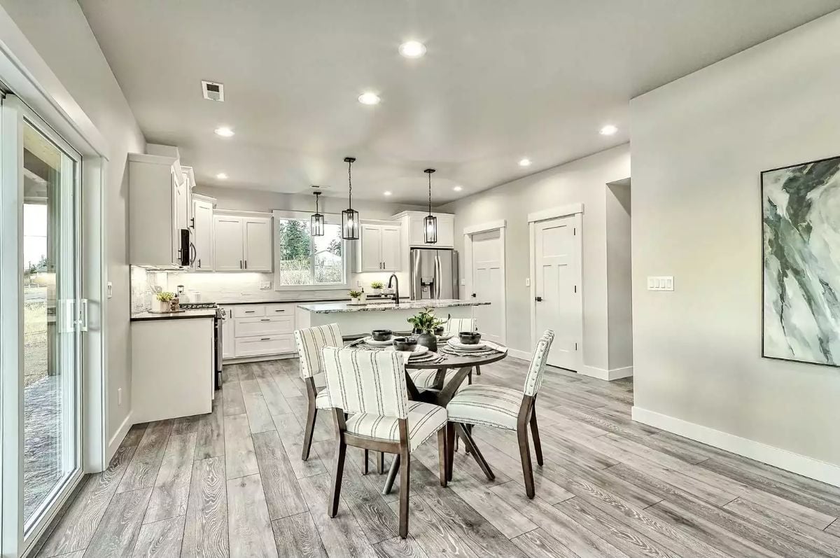 Pendant Lights Over an Island Pull the Kitchen and Dining Room Into One Conversation