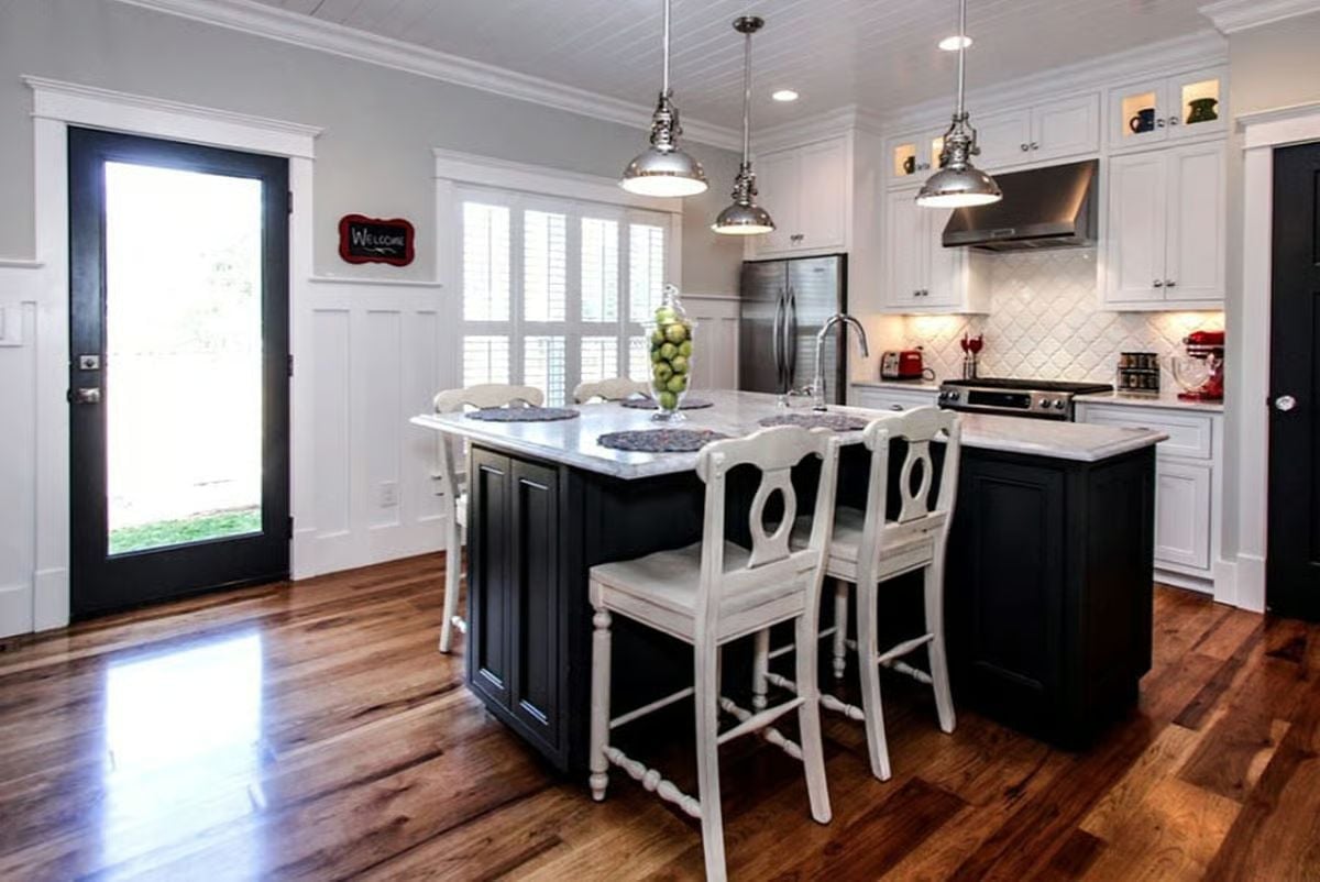 Black Island, White Chairs, and Pendant Lights That Mean Business