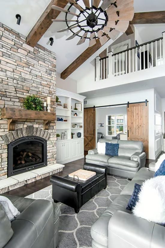 Windmill Ceiling Fan Above Stone Fireplace Is a Lot, and It Works