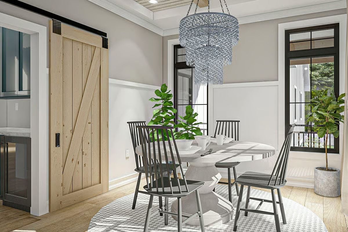 Crystal Chandelier Over a Pedestal Table Proves Farmhouse Can Do Glamour