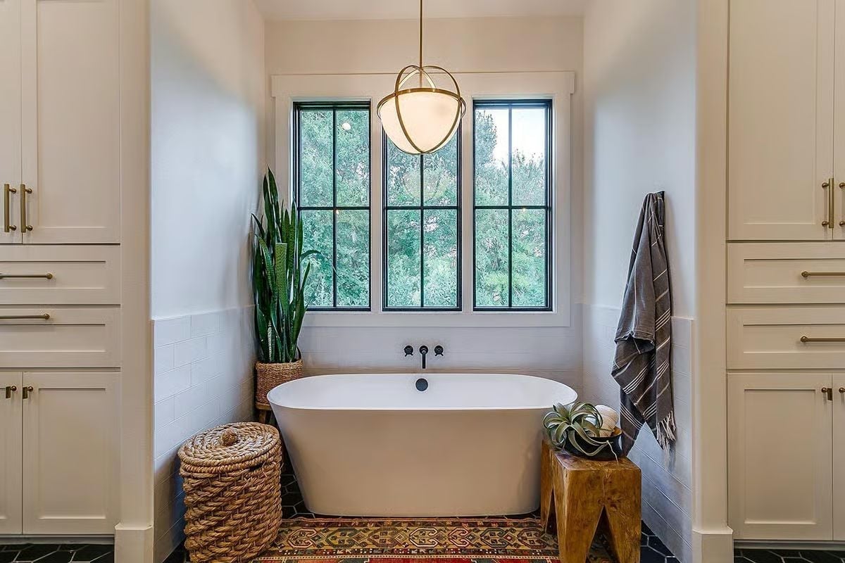 Freestanding Tub Niche With Steel Windows That Make the Outdoors Part of the Bath