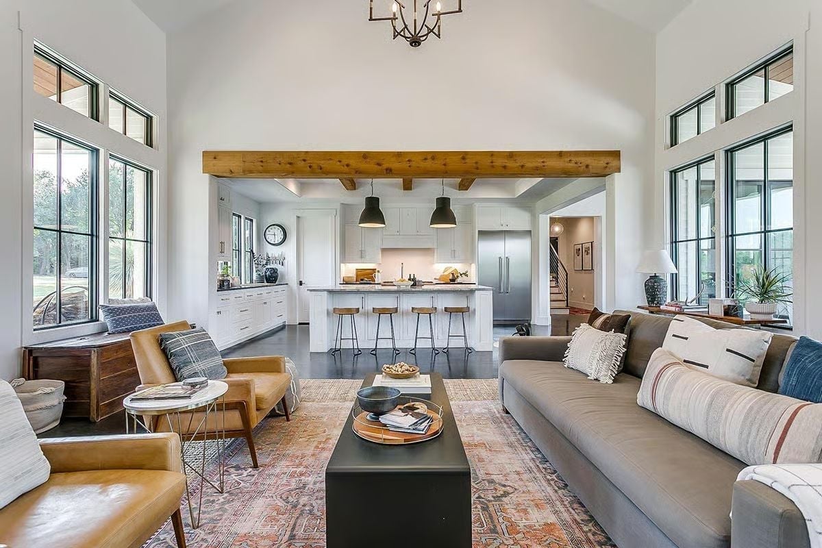 Leather Chairs, Exposed Beams, and a Kitchen That's Always Part of the Conversation