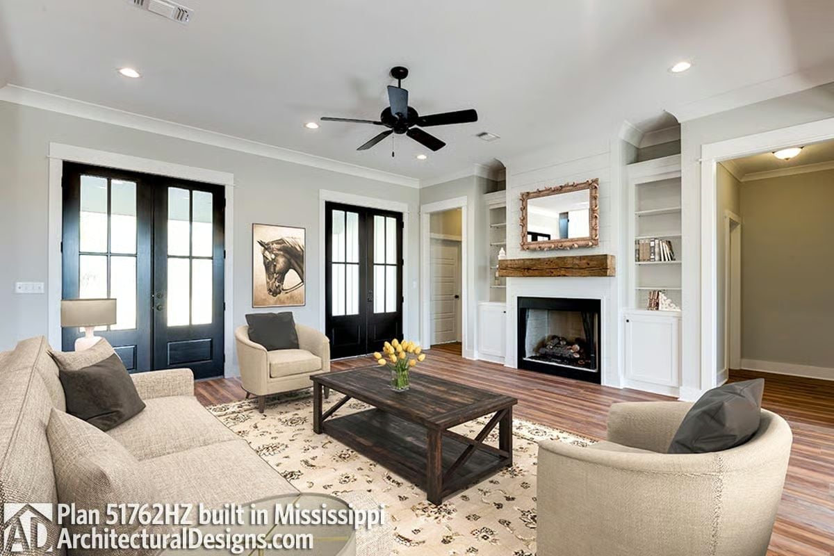 Reclaimed Wood Mantel and Black French Doors Set the Tone Early