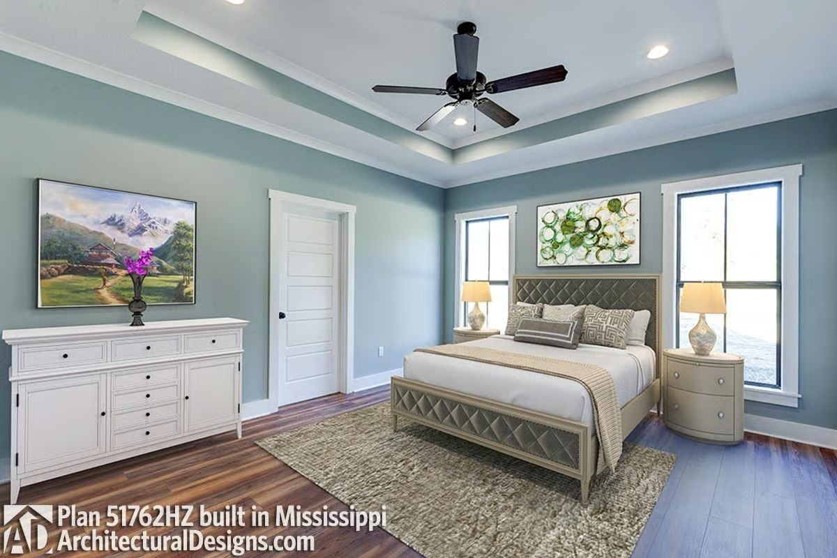 Tray Ceiling and Diamond-Tufted Headboard Pull This Bedroom Together