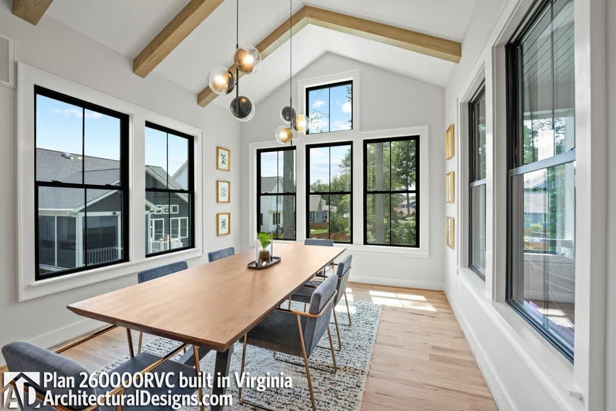 Black-Frame Windows and Exposed Beams Turn a Dining Room Into Something Worth Sitting In