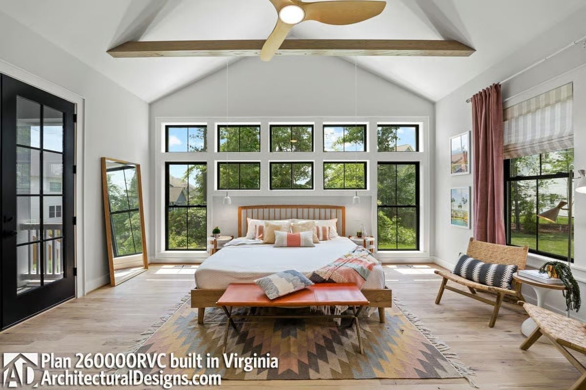 Cathedral Ceiling and Black-Frame Windows Give This Primary Bedroom Nowhere to Hide
