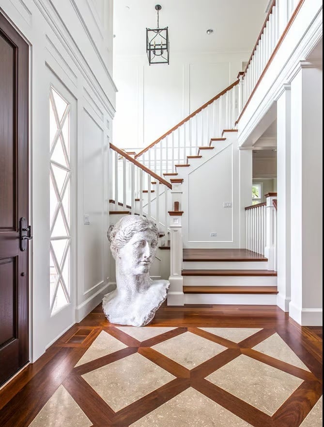 Classical Bust Anchors an Entry Hall Built Around Earned Grandeur