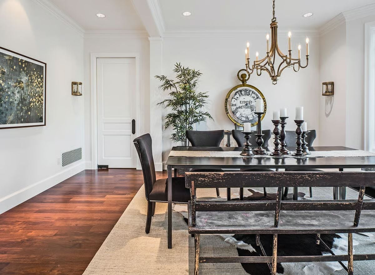 Distressed Bench and Dark Candlesticks Do the Heavy Lifting at This Dining Table