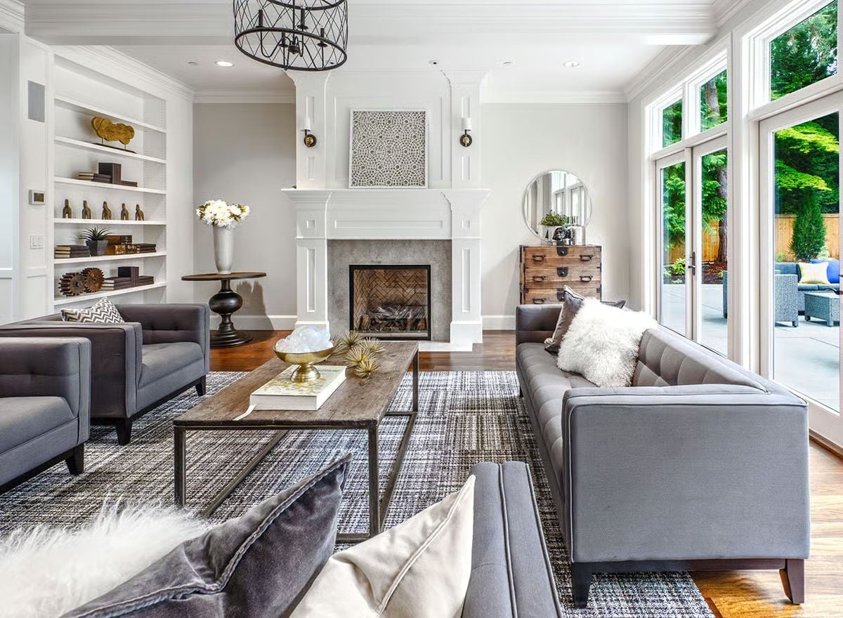 Gray Sofas and a White Fireplace Surround Pull the Room Together Without Competing