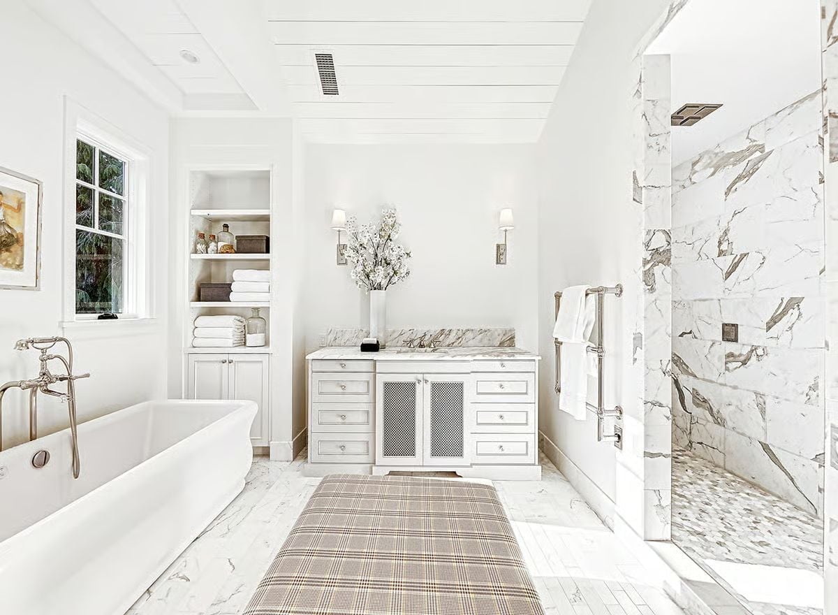 Marble Shower Wall and Freestanding Tub Share Space Without Either Backing Down