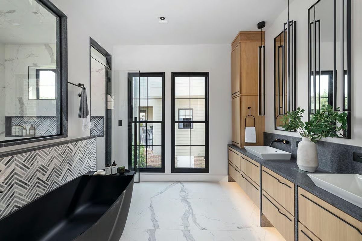 Matte Black Soaking Tub, Herringbone Tile, and a Shower That Earns Its Square Footage