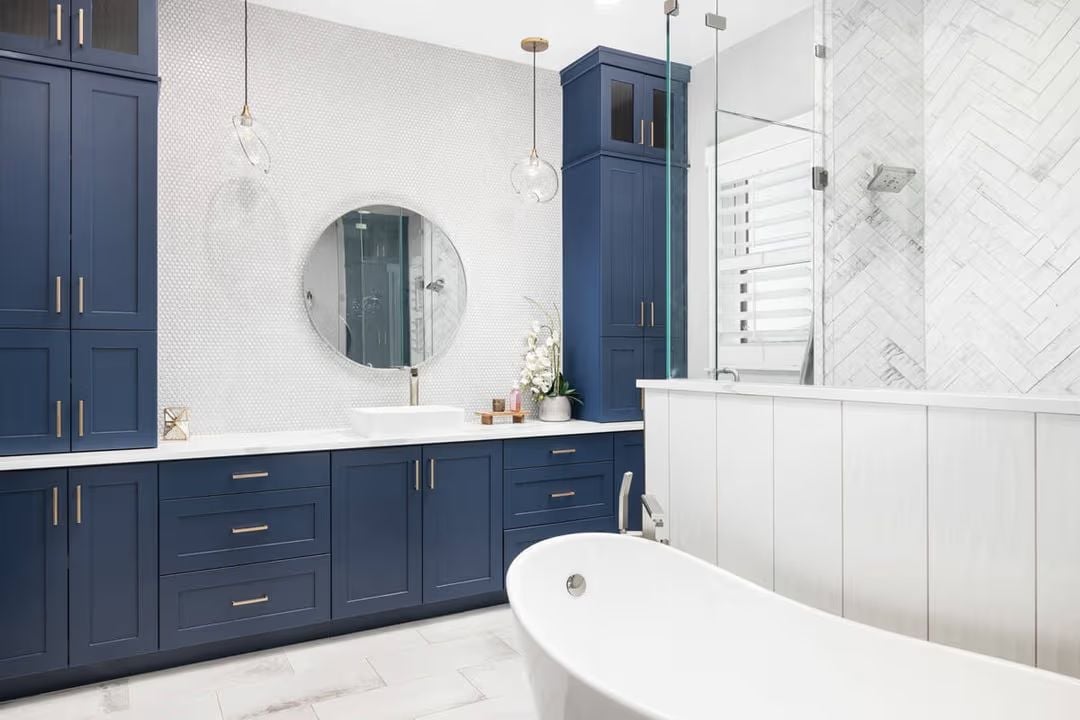 Navy Cabinetry, Penny Tile, and a Soaking Tub That Earns Its Square Footage
