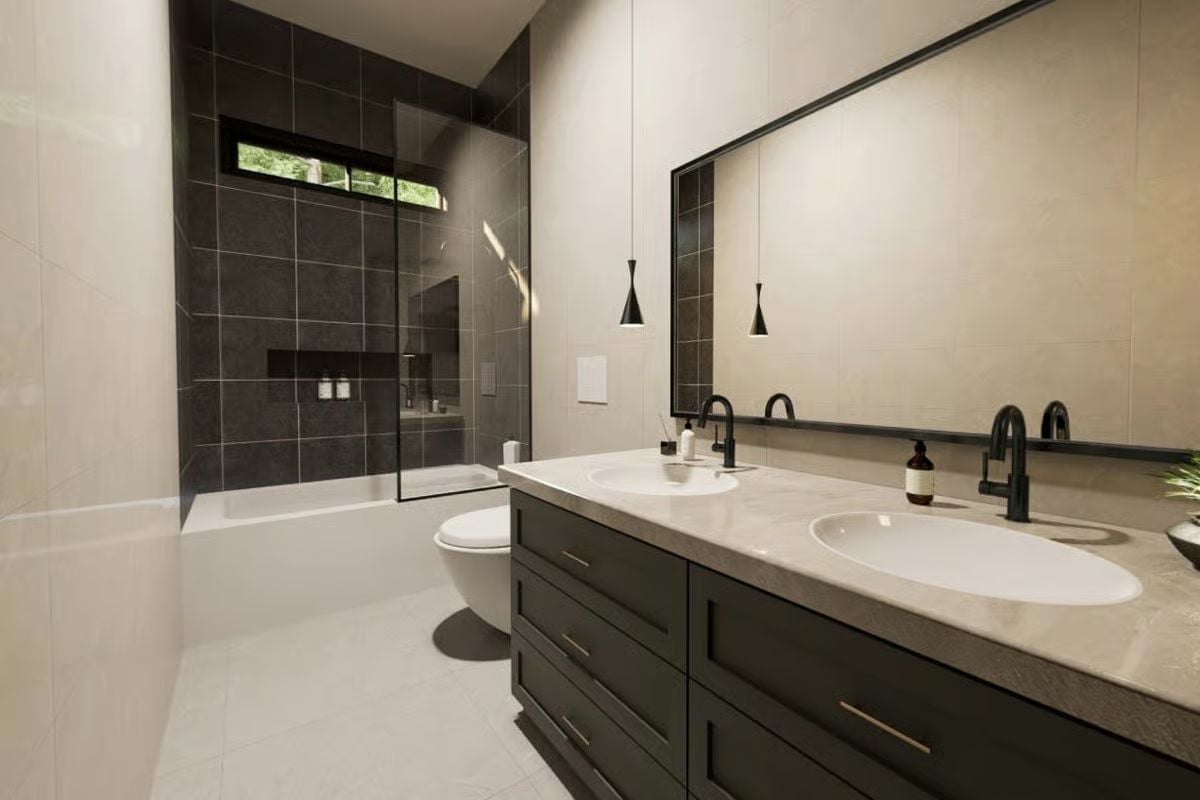 Matte Black Fixtures Against Stone Countertops Keep This Bathroom Grounded