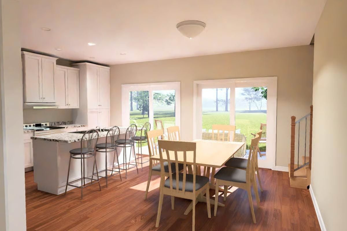 Granite Counters, Bar Stools, and Sliding Doors That Erase the Back Wall