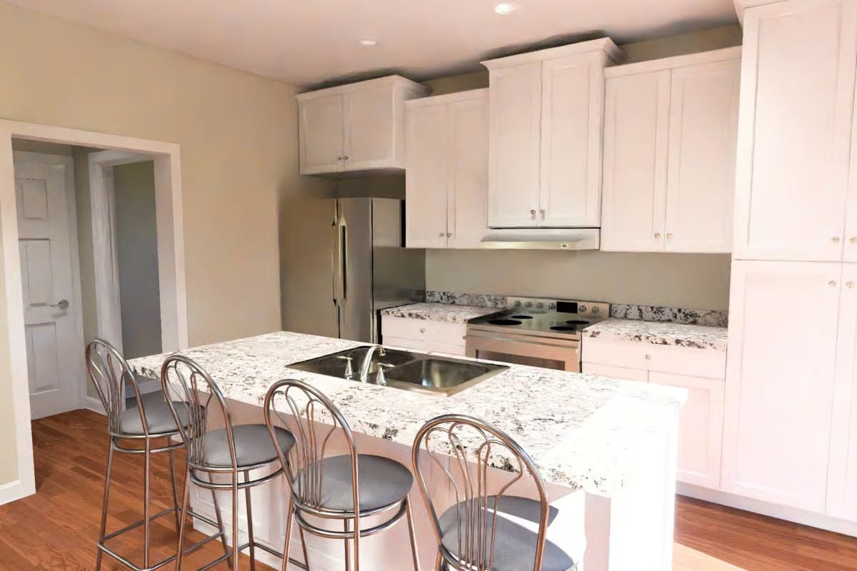 Granite Island with a Cooktop Built Right Into the Counter Changes How You Cook