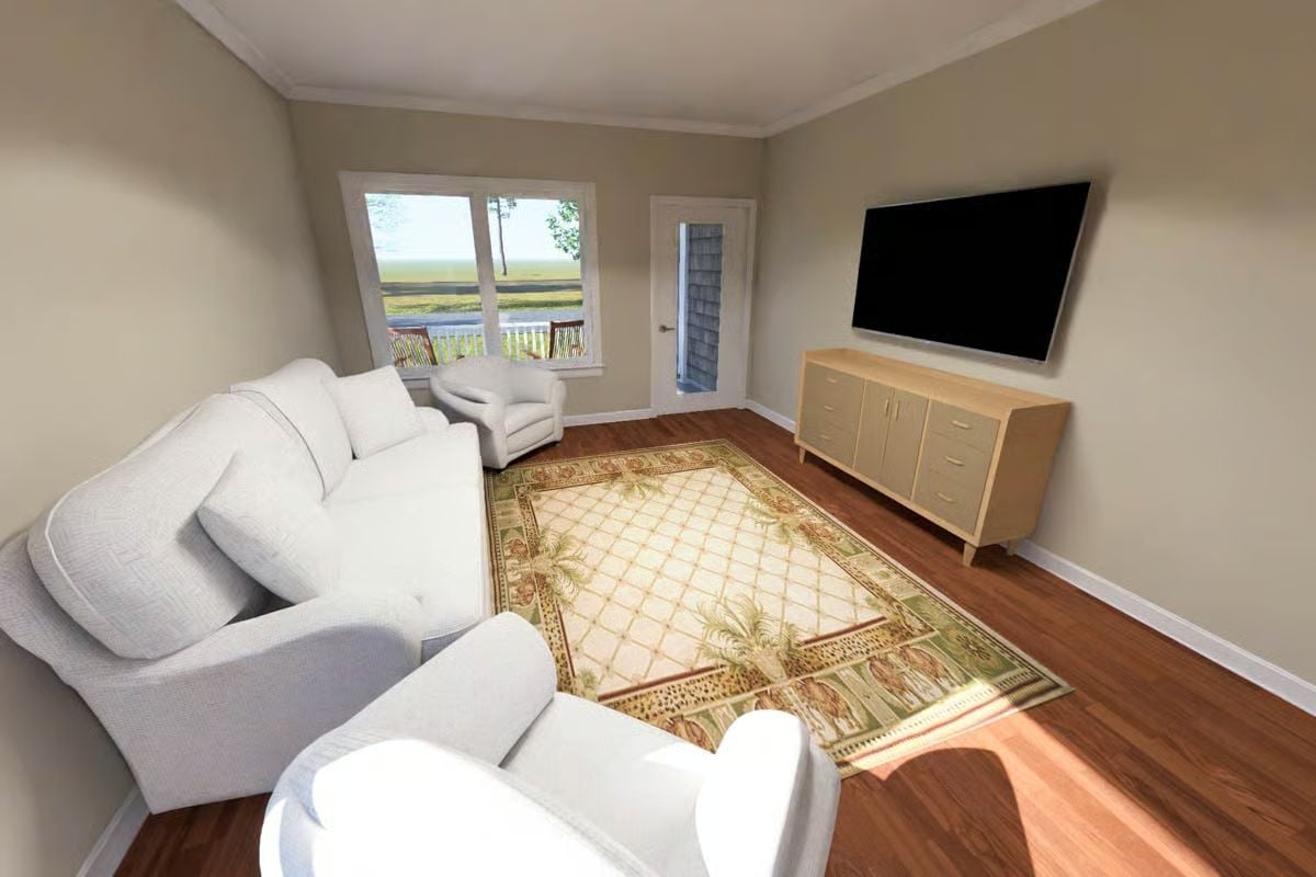 Warm Wood Floors and a Palm-Print Rug Give This Living Room Its Laid-Back Personality