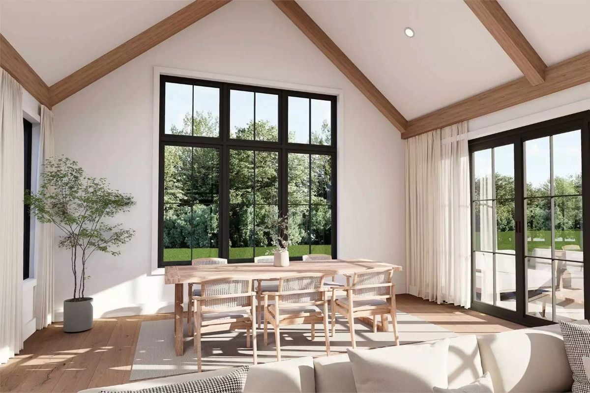 Cathedral Ceiling, Black-Frame Glass, Sun Pooling Across the Dining Floor
