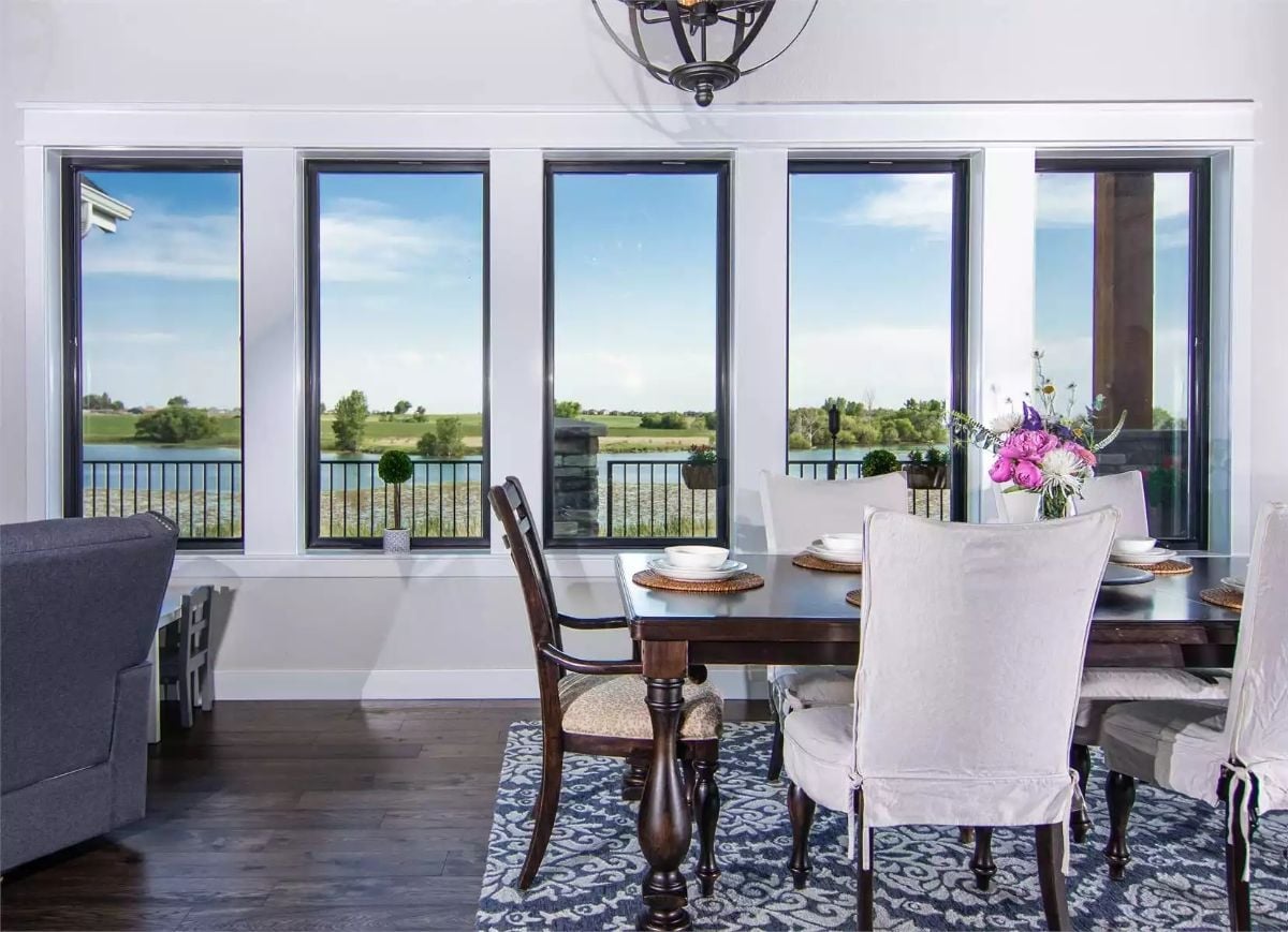 Five Black-Framed Windows and a Water View That Earns Its Place at the Table