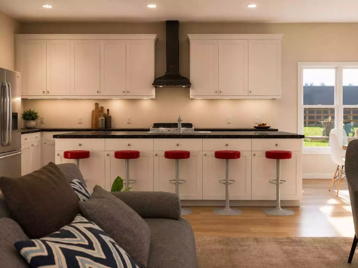 Red Barstools Against Black Granite Make a Strong Case for Contrast