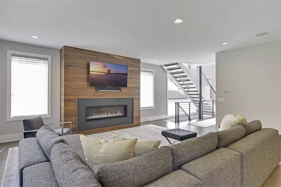 Wood-Clad Fireplace Wall Earns Every Square Inch of Attention It Gets