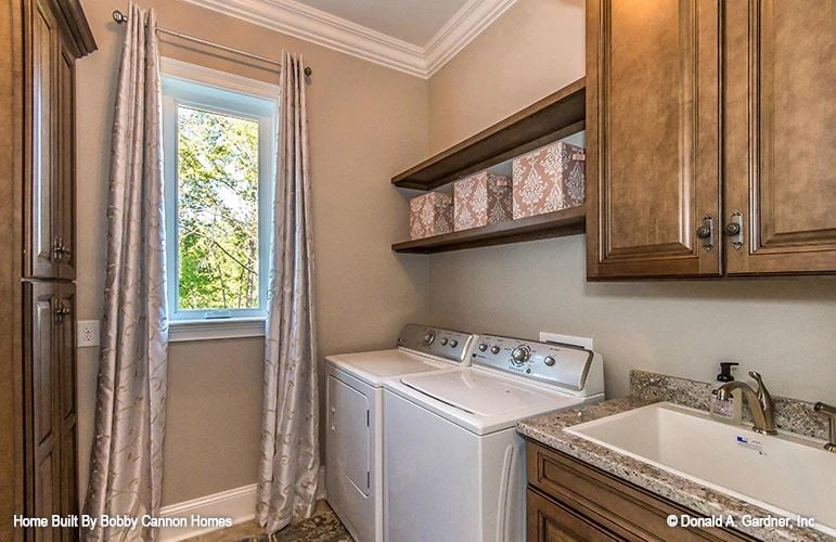 Shelved Storage and a Utility Sink That Make Laundry Feel Less Like a Chore