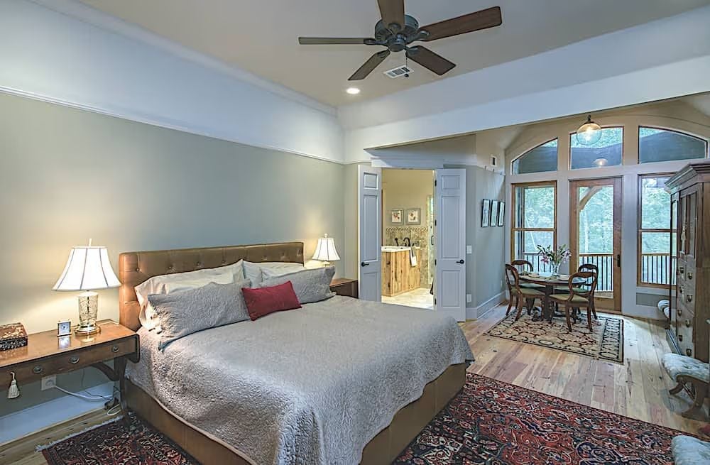 Leather Headboard, Persian Rug, and French Doors That Open to the Trees