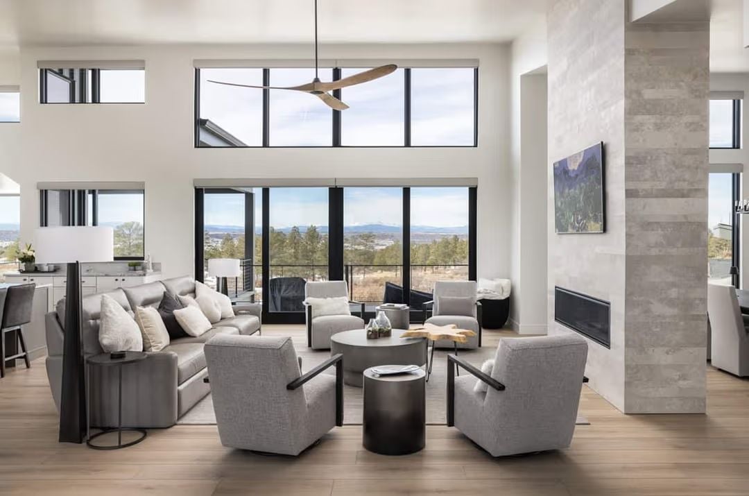 Double-Height Views and a Fireplace That Anchors the Whole Room