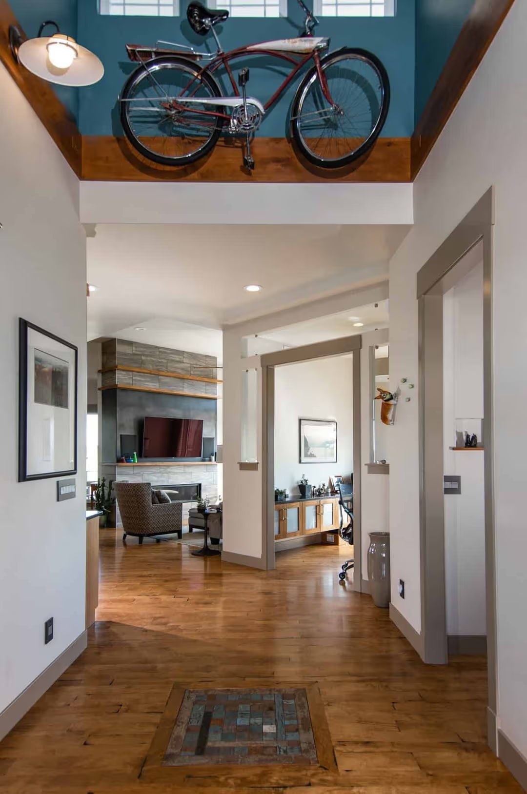 Vintage Cruiser Mounted Above the Entry Makes the Whole House Introduce Itself