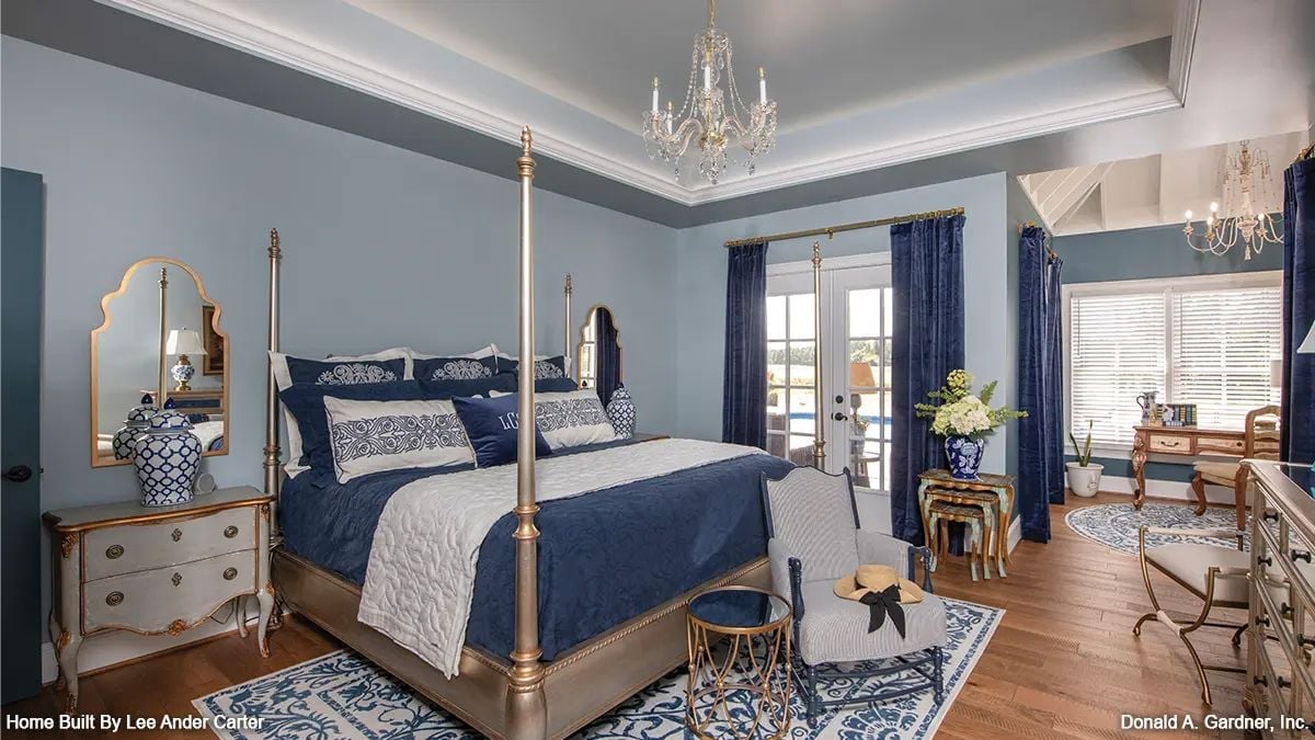Gold Four-Poster, Crystal Chandelier, and Navy That Earns Its Keep