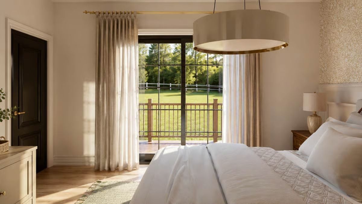 Brass Hardware, Sheer Curtains, and a Balcony Door Framing the Green Below